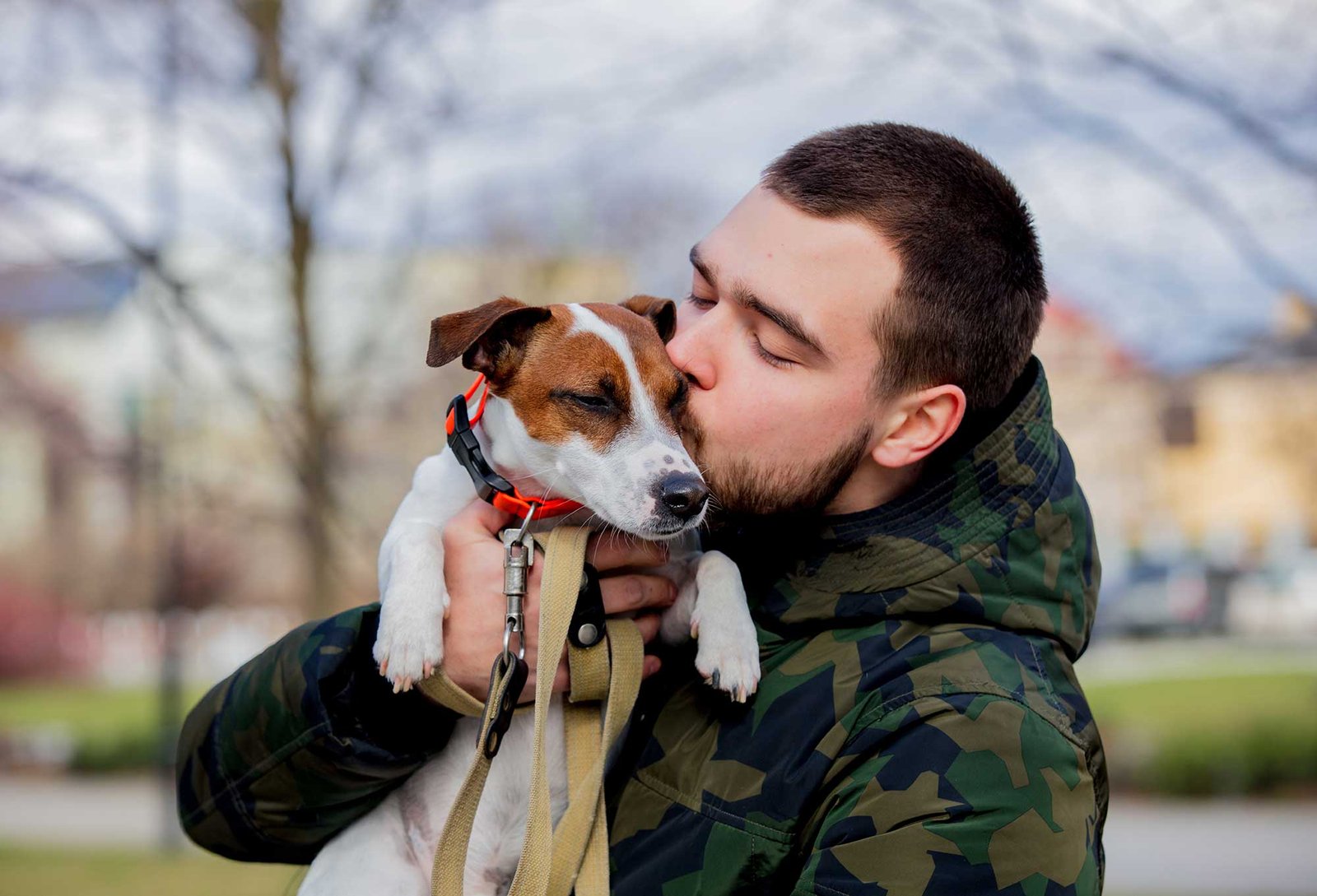 young-man-with-his-dog-jack-russell-terrier-2022-01-12-05-09-31-utc.jpg